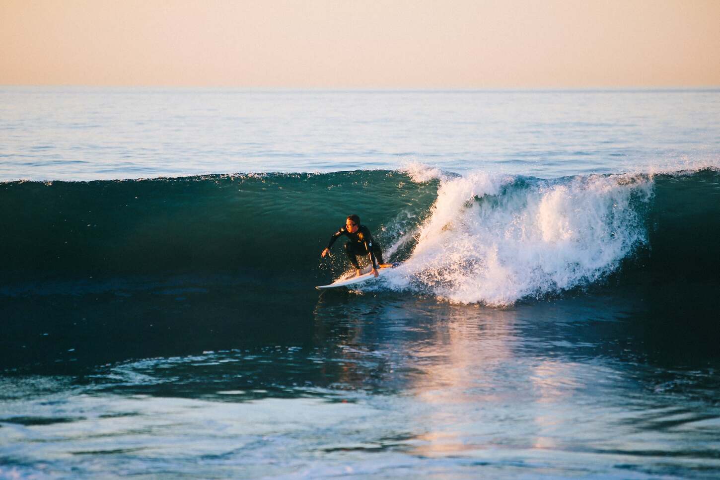 a man surfing in agadir beach
